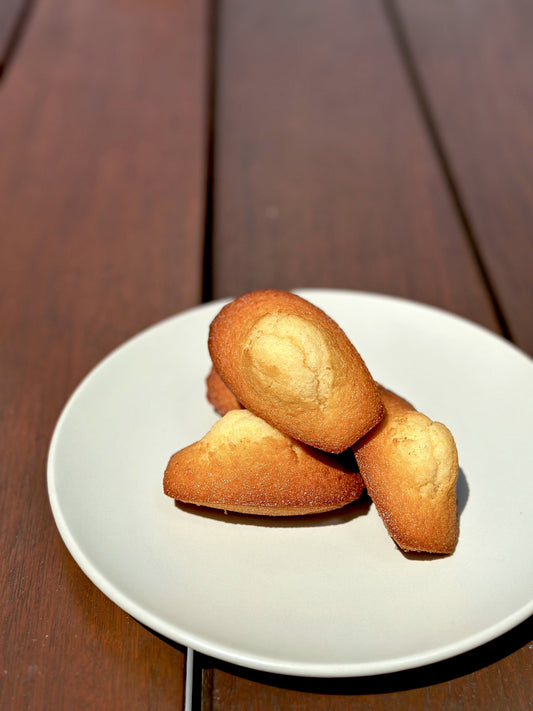 Madeleines with Chestnut Honey, Lemon and Orange Zest. Delicate and buttery, our madeleines are infused with the rich, nutty flavor of chestnut honey, as well as the bright and tangy notes of fresh lemon and orange zest. Perfect for a sweet snack or with your afternoon tea.