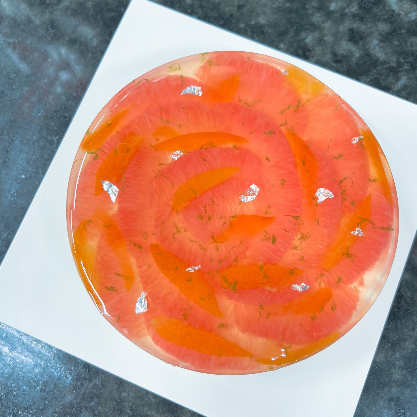 Top view of Grapefruit Fromage Blanc Cake with Jelly Layer and Citrus Fruit Decoration