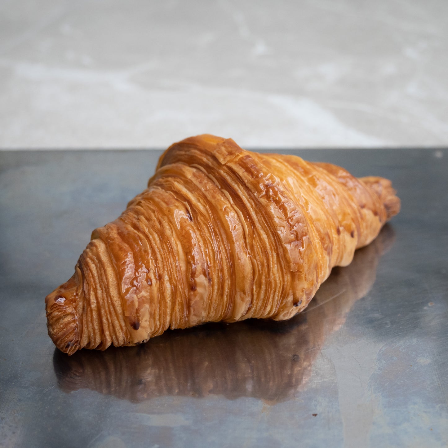 Freshly baked croissant made with the finest AOP butter for a rich, buttery taste and flaky texture.