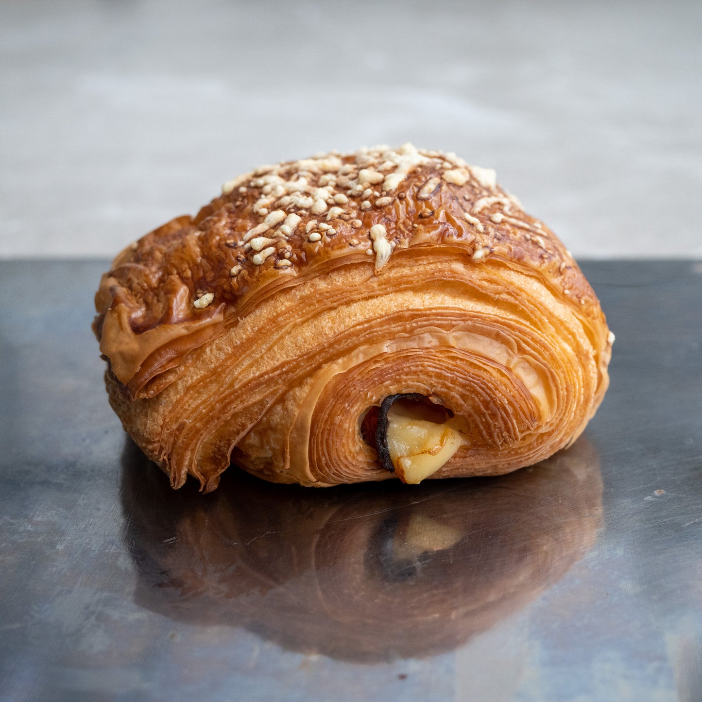 Ham and cheese croissant, made with flaky croissant dough, filled with savory ham and emmental cheese.